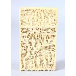 A GOOD CHINESE CANTON CARVED IVORY CARD CASE, carved with figures in a busy landscape, 9.5cm x 5.