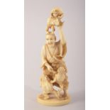 A SMALL JAPANESE CARVED IVORY FIGURE OF A MAN WITH FROGS, mark to base, 10cm high.