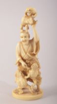 A SMALL JAPANESE CARVED IVORY FIGURE OF A MAN WITH FROGS, mark to base, 10cm high.