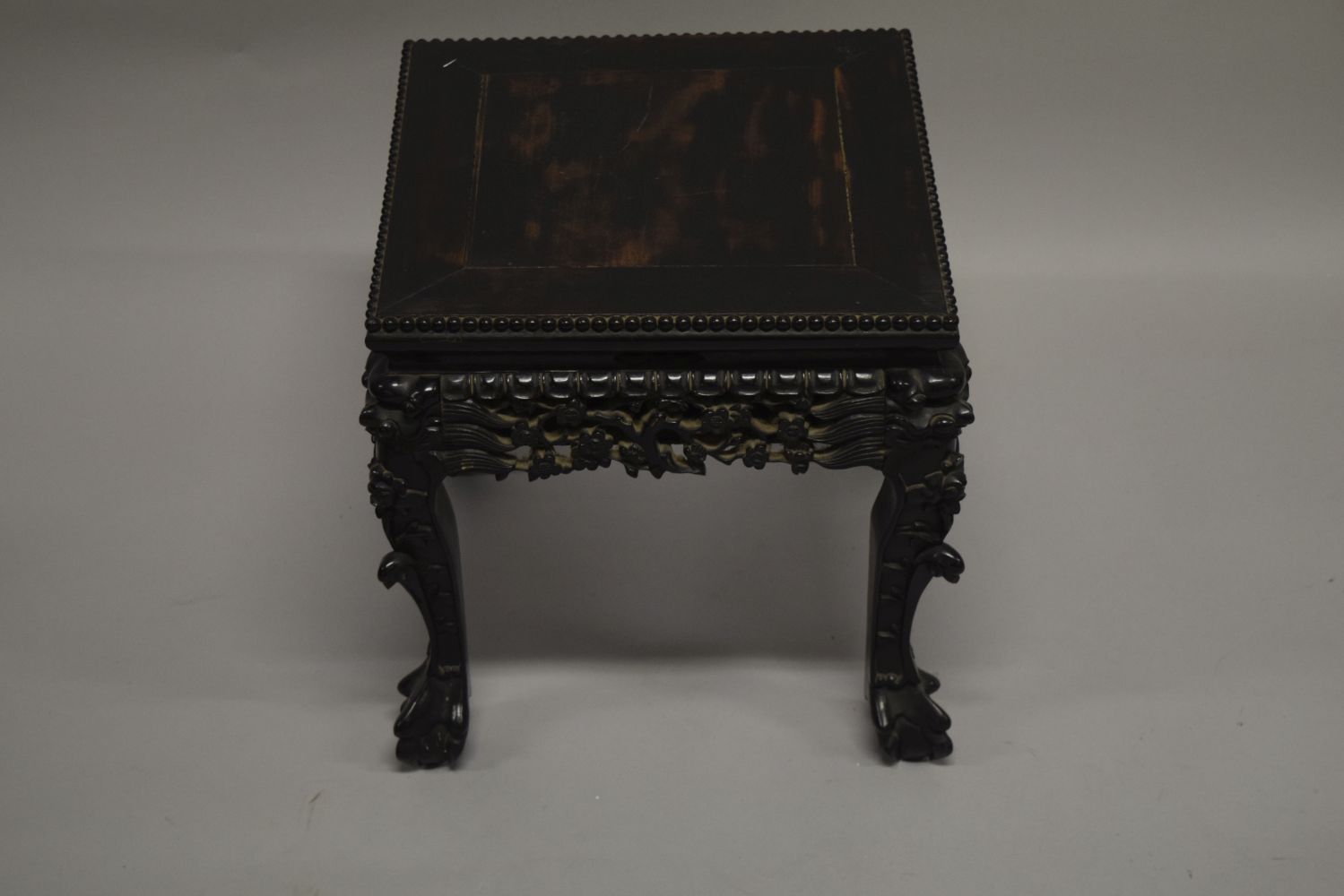 A SMALL CHINESE SQUARE FORM HARDWOOD TABLE, with carved floral frieze, supported on four curving - Image 4 of 6