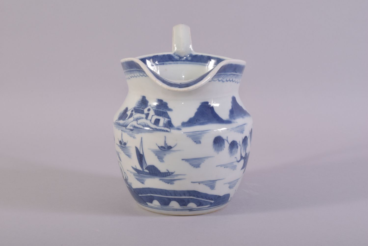 A CHINESE BLUE AND WHITE PORCELAIN JUG, decorated with a landscape scene depicting buildings, - Image 2 of 6