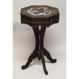 AN UNUSUAL CHINESE OCTAGONAL CARVED HARDWOOD PEDESTAL TABLE, the top inset with a cloissonne panel