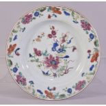 A CHINESE FAMILLE ROSE PORCELAIN PLATE, the centre with floral spray, the border painted with