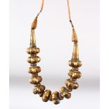 AN ISLAMIC GILDED SOFT METAL NECKLACE.