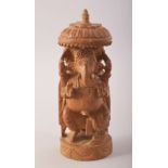 AN INDIAN CARVED SANDALWOOD FIGURE OF GANESHA, 14cm high.