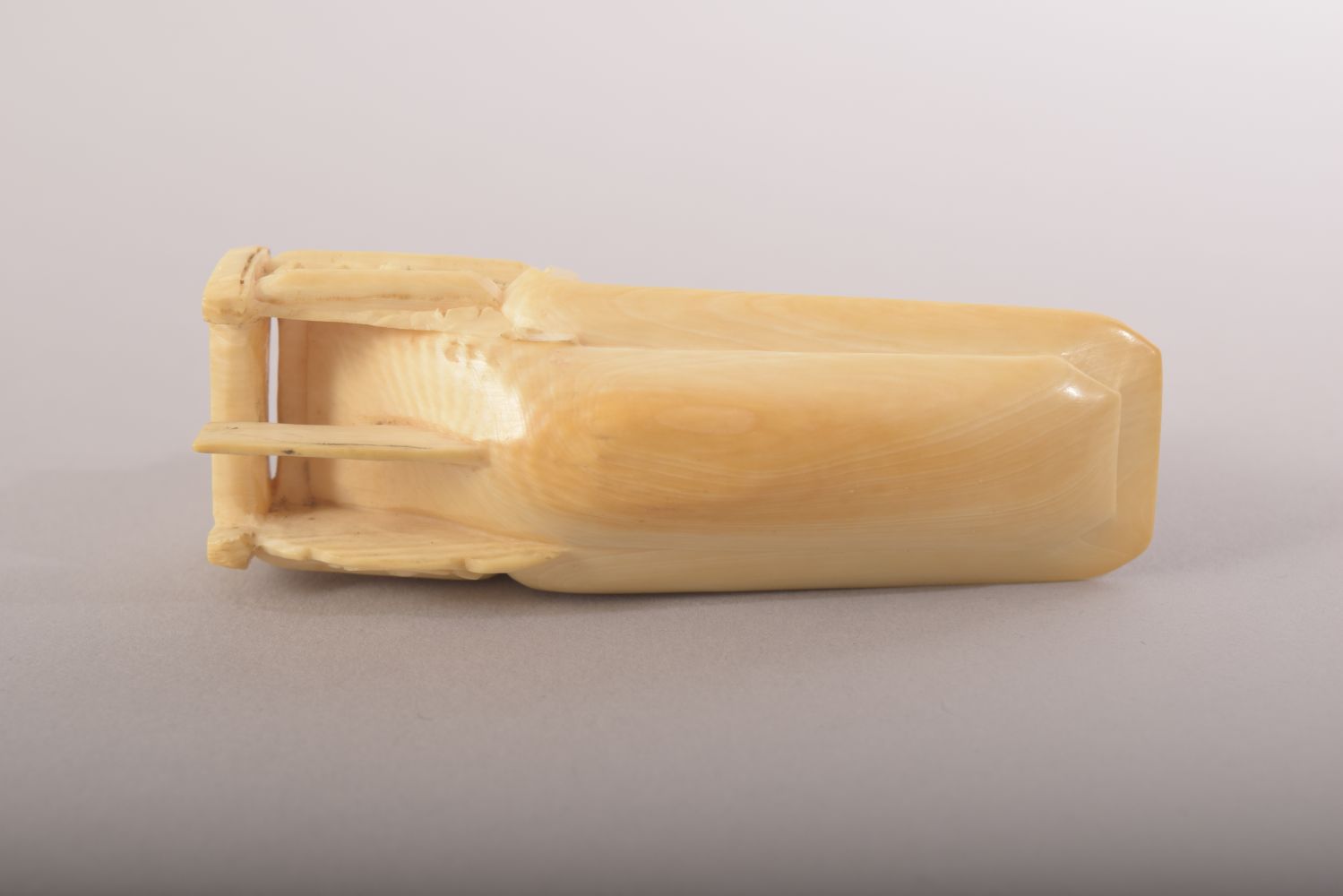 A SMALL CARVED IVORY MODEL OF A JUNK and wooden stand, 8cm long. - Image 7 of 8