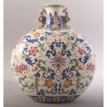 A CHINESE FAMILLE ROSE PORCELAIN TWIN HANDLE MOON FLASK, painted with an array of flowers and