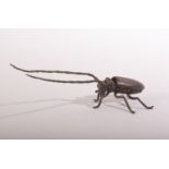 A JAPANESE BRONZE MODEL OF A LONG HORNED BEETLE - articulated with an opening back 14.5cm