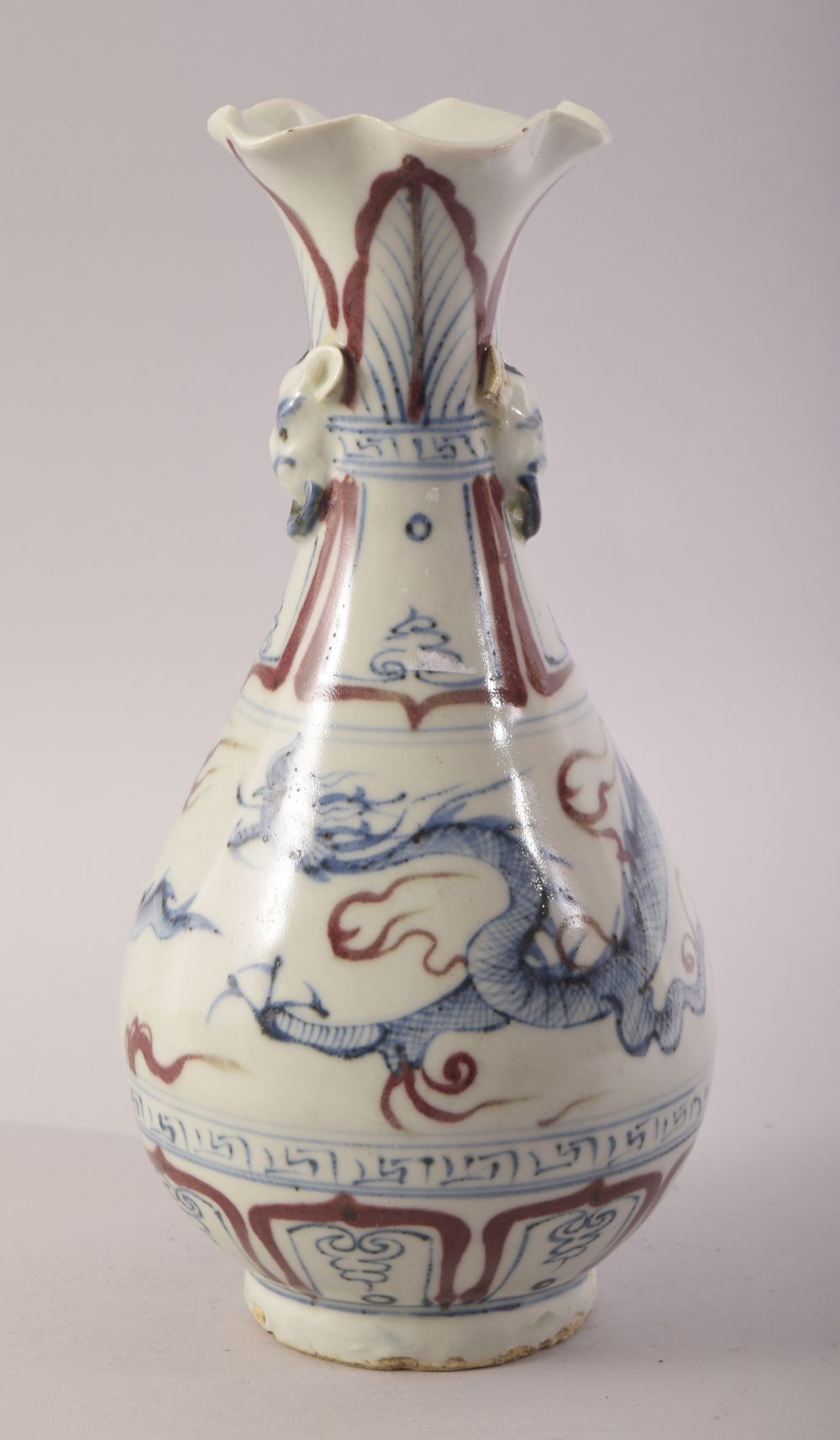 A SMALL CHINESE YUAN STYLE GLAZED POTTERY VASE, painted with a dragon, the neck with two small