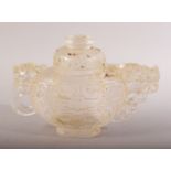 A CHINESE CARVED / MOULDED GLASS TEAPOT & COVER - decorated with dragons and chilong - 14cm