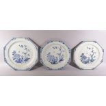 THREE LARGE CHINESE BLUE AND WHITE OCTAGONAL PORCELAIN PLATES, each painted with native flora, (AF),