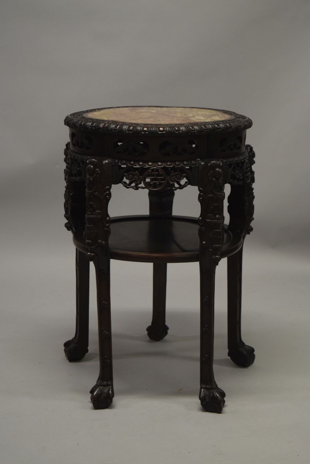 A LARGE AND IMPRESSIVE CHINESE HARDWOOD MARBLE TOP URN STAND, the frieze carved and pierced with - Image 4 of 5