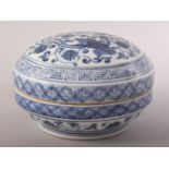 A CHINESE BLUE AND WHITE PORCELAIN CIRCULAR BOX AND COVER, the cover decorated with phoenix, lotus