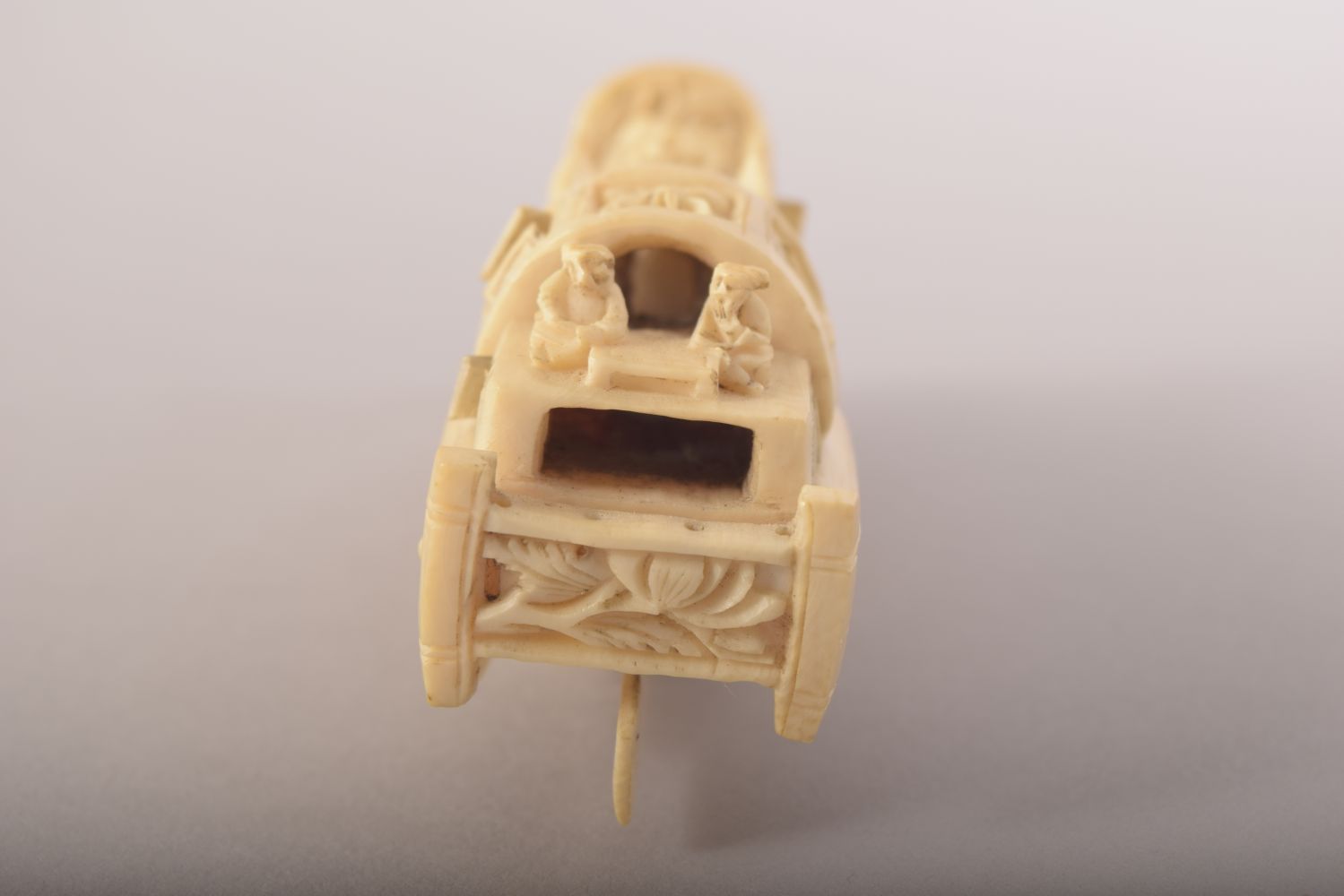 A SMALL CARVED IVORY MODEL OF A JUNK and wooden stand, 8cm long. - Image 5 of 8