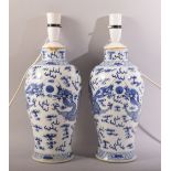 A GOOD PAIR OF CHINESE BLUE AND WHITE PORCELAIN VASES, converted to lamps (not drilled), the body of