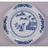 A CHINESE BLUE AND WHITE PORCELAIN DISH, painted with native flora, 21.5cm diameter.