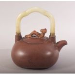 A CHINESE YIXING CLAY JADE HANDLE TEAPOT - the handle with a ruyi model with inset stones- the