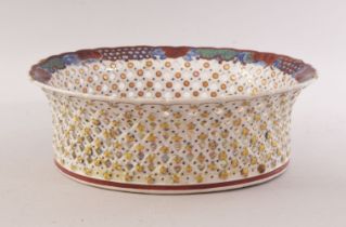 A 19TH CENTURY CHINESE OVAL PIERCED 'CLOBBERED' PORCELAIN BASKET, painted with a landscape, mark