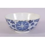 A SMALL CHINESE BLUE AND WHITE PORCELAIN BOWL, painted with stylised flower heads and scrolling