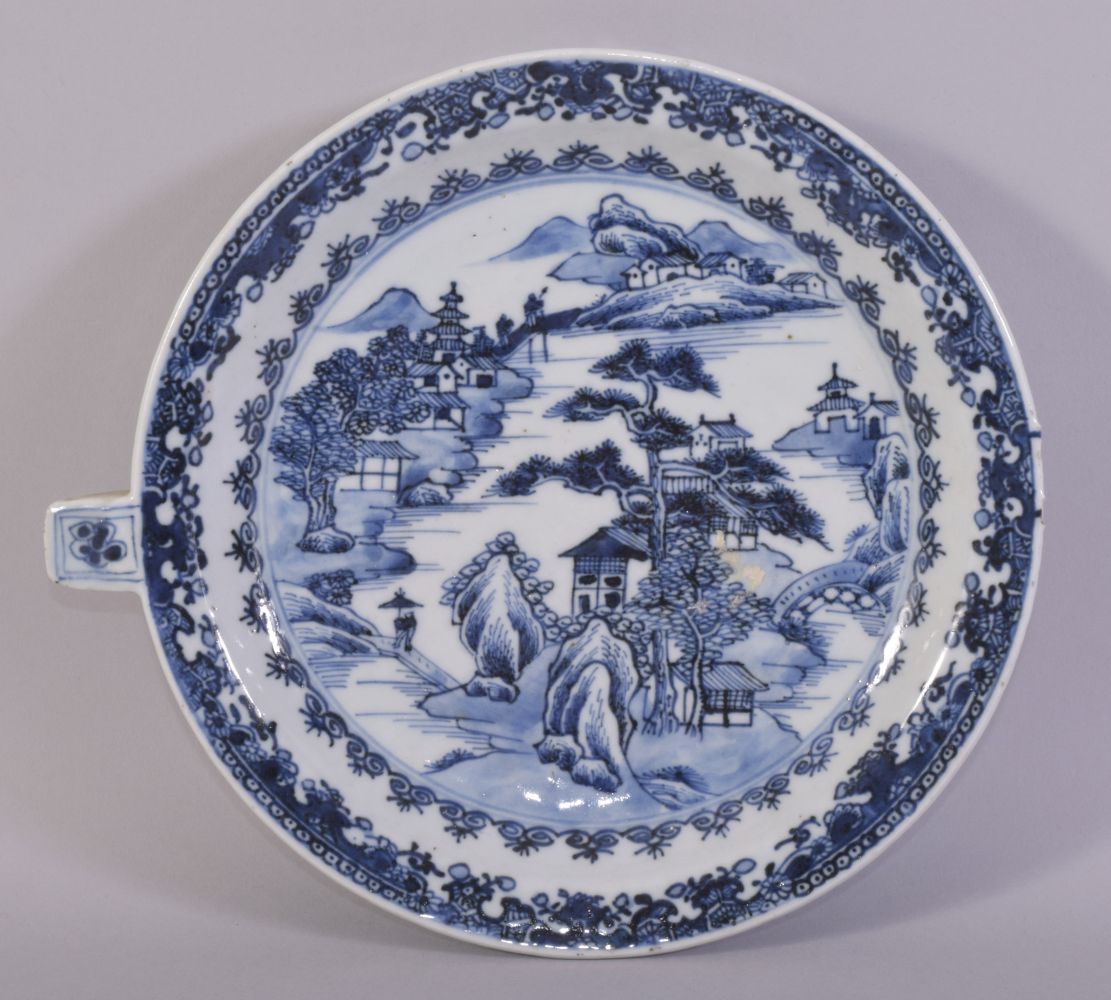 A CHINESE BLUE AND WHITE PORCELAIN WARMING DISH, painted with a landscape scene, 23.5cm.