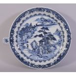 A CHINESE BLUE AND WHITE PORCELAIN WARMING DISH, painted with a landscape scene, 23.5cm.
