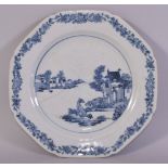 A CHINESE BLUE AND WHITE PORCELAIN DISH, painted with a scene with dogs and buildings, 22cm