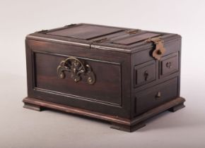 A CHINESE WOODEN VANITY BOX, the lid opening to reveal a mirror, the box comprising three drawers,