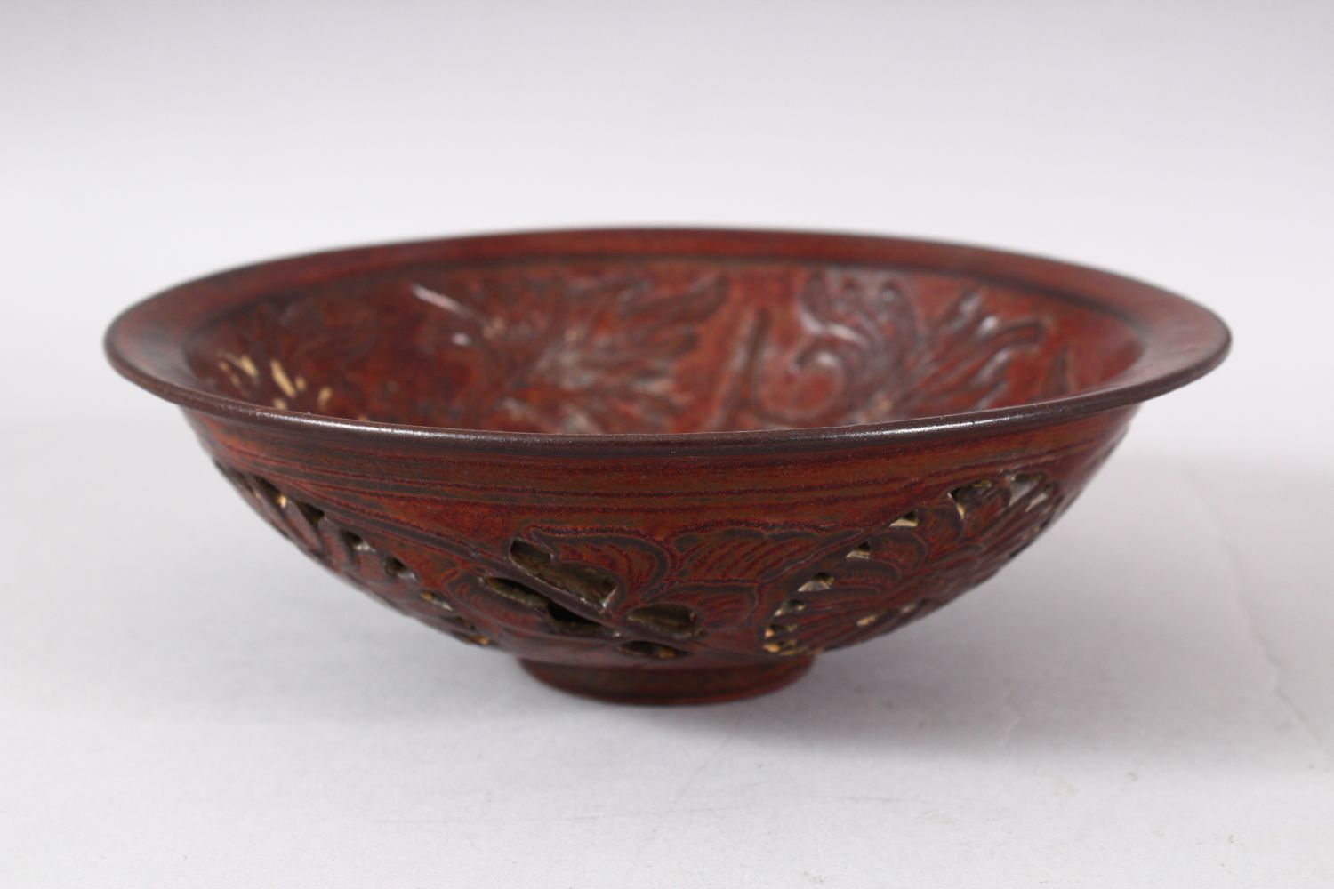 A CHINESE PIERCED POTTERY BOWL - the interior decorated with scenes of flora, the underside with - Image 4 of 6