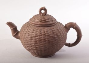 A GOOD CHINESE YIXING TEAPOT, with basket weave decoration, mark to inner lid, impressed four