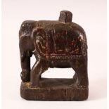A 17TH CENTURY INDIAN CARVED WOOD FIGURE OF AN ELEPHANT, 14.5cm high.
