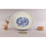 A MIXED LOT WITH A CHINESE BLUE AND WHITE RIBBED PORCELAIN DISH, together with a pierced jade