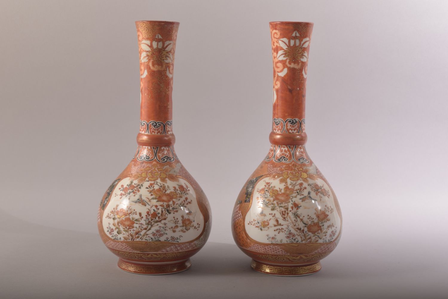A PAIR OF JAPANESE KUTANI PORCELAIN VASES, each painted with a panel depicting two figures at a - Image 3 of 8