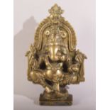 AN 18TH/19TH CENTURY INDIAN BRASS FIGURE OF GANESHA, 12.5cm high.