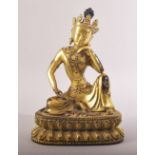 A FINE CHINESE OR TIBETAN GILT BRONZE BUDDHA, seated in a contemplative posture, 20cm high.