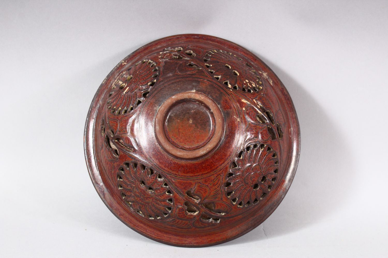 A CHINESE PIERCED POTTERY BOWL - the interior decorated with scenes of flora, the underside with - Image 6 of 6