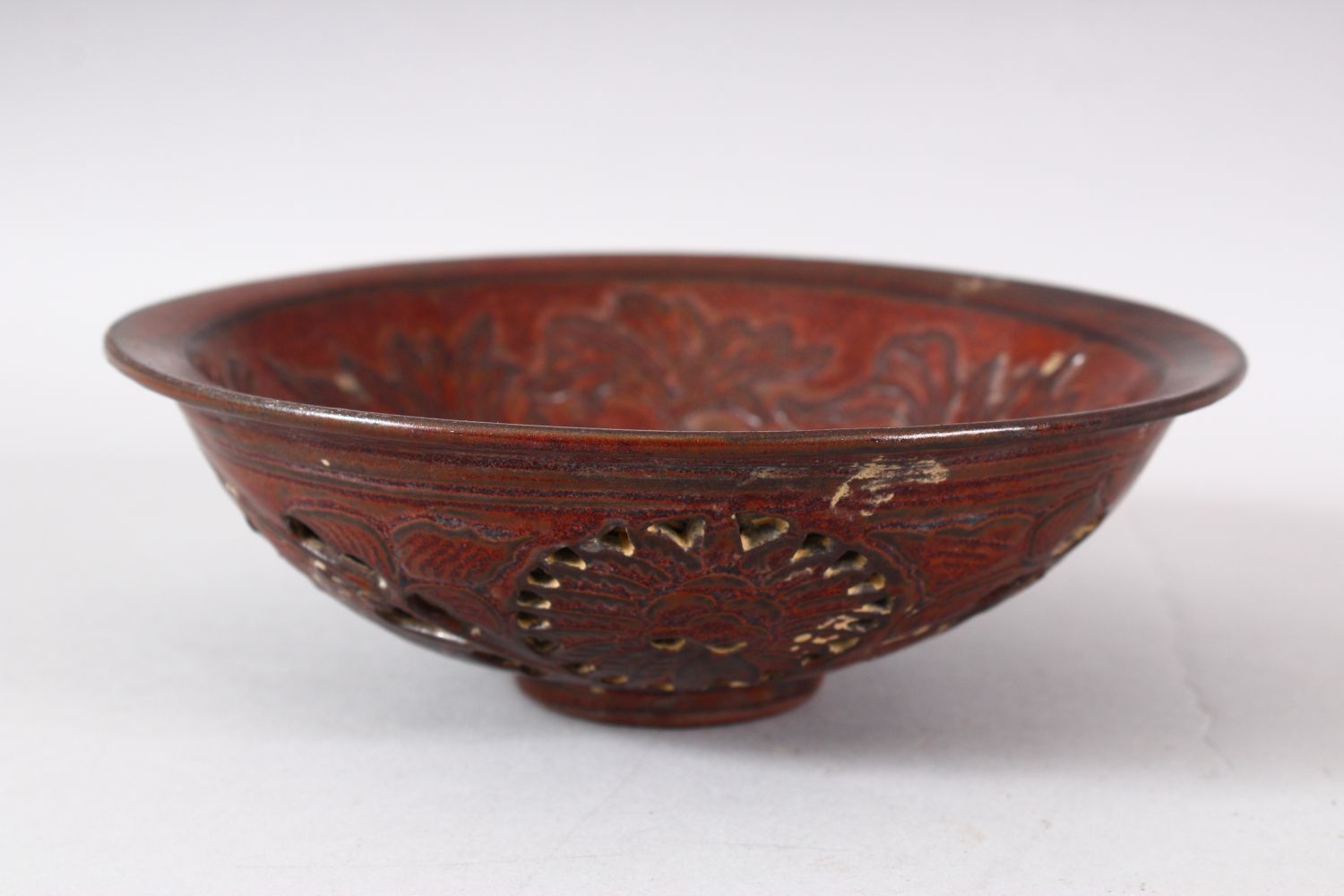 A CHINESE PIERCED POTTERY BOWL - the interior decorated with scenes of flora, the underside with - Image 2 of 6
