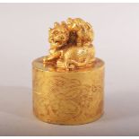 A CHINESE GILT BRONZE LION DOG SEAL - the top with two lion dogs - the underside with four character