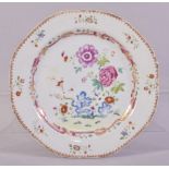 A CHINESE FAMILLE ROSE PORCELAIN PLATE, the centre painted with native flora, the border with