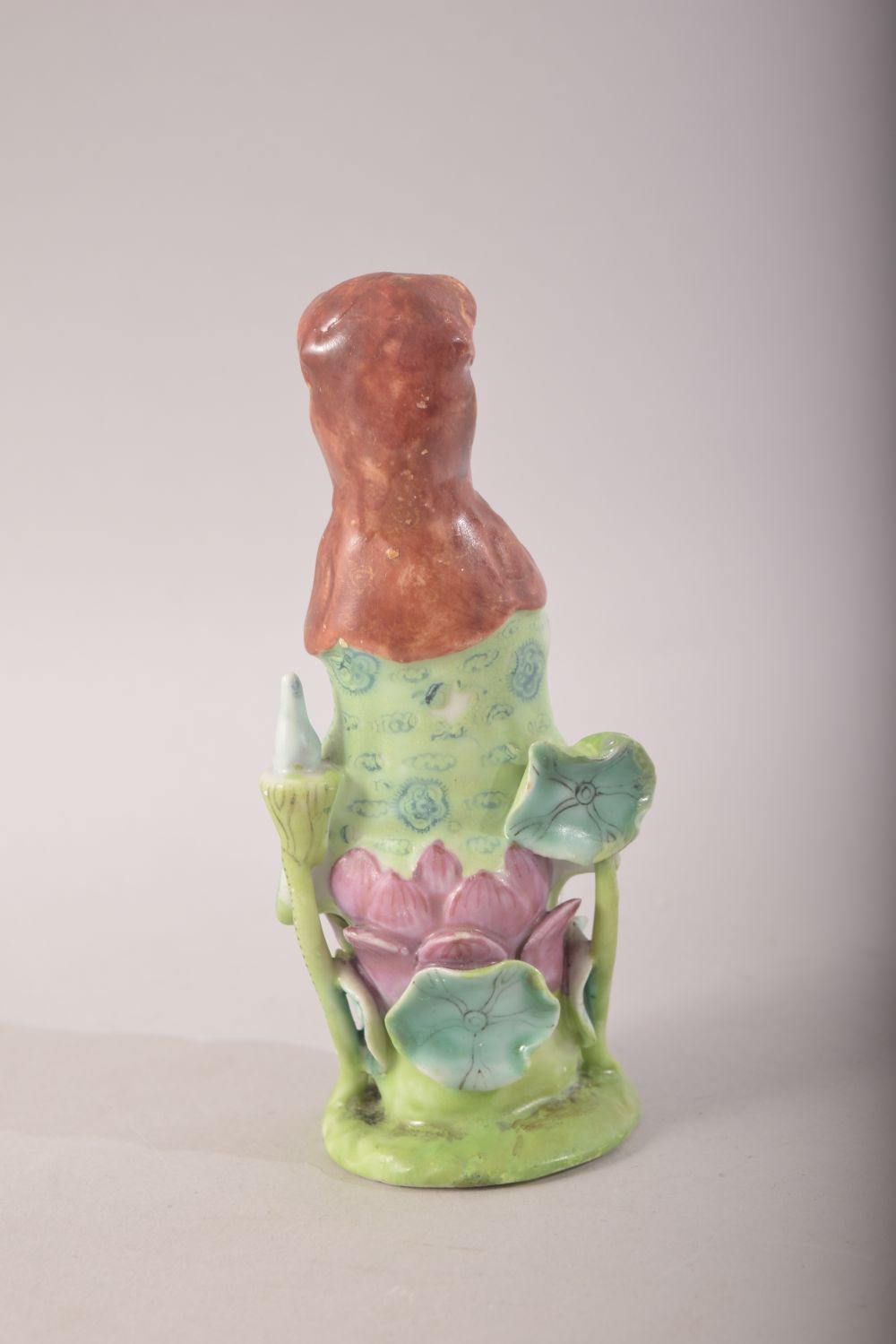A SMALL CHINESE PORCELAIN FIGURE OF A FEMALE amongst lilies, 13cm high. - Image 3 of 7