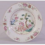 A CHINESE FAMILLE ROSE PORCELAIN SOUP DISH, the centre painted with native flora and with flowers to