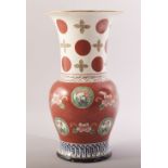 A LATE 19TH CENTURY JAPANESE RED AND WHITE VASE, the body painted with motifs of flowers and