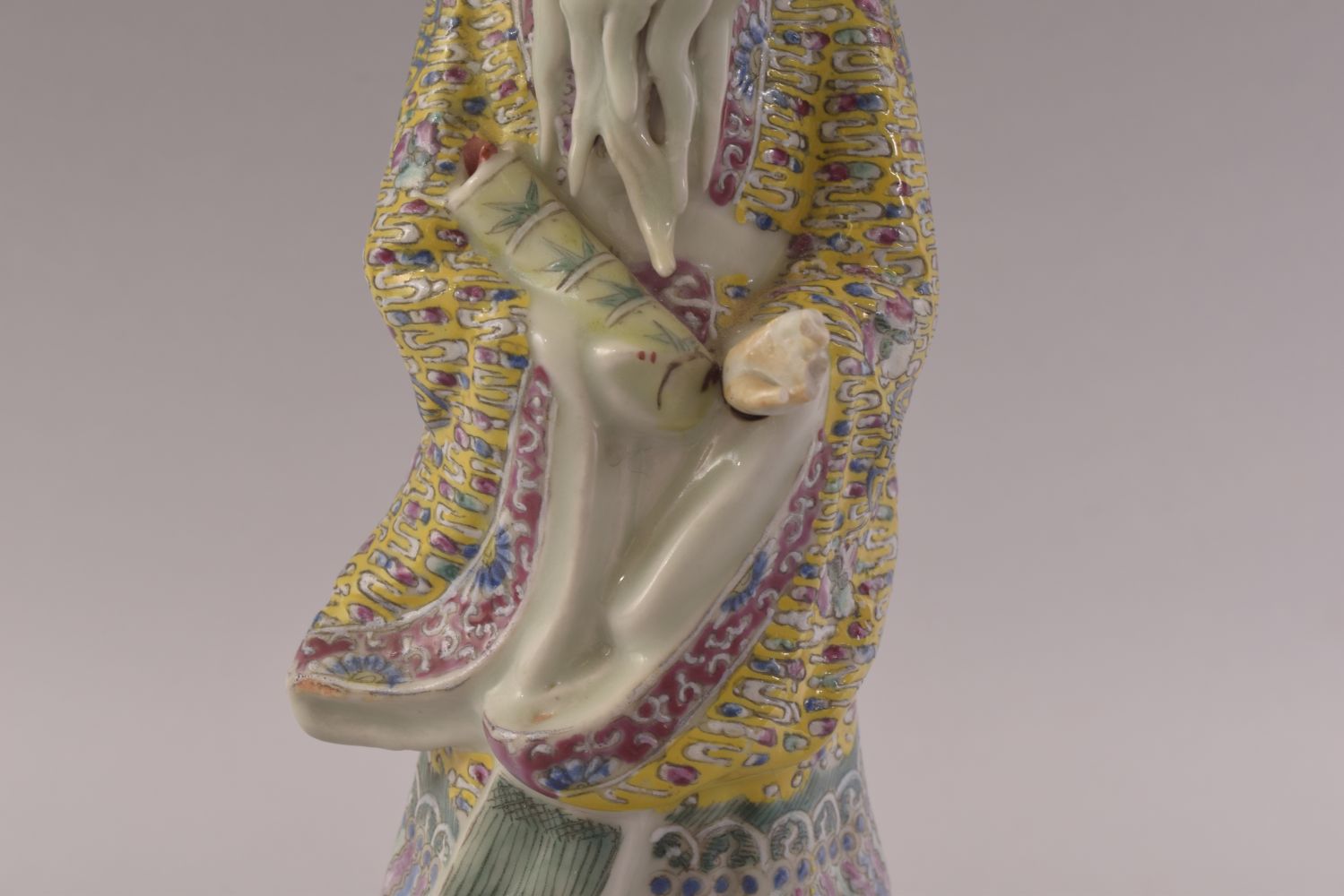 A CHINESE FAMILLE ROSE PORCELAIN FIGURE OF A SAGE, stood upon a wave formation with a mask of a - Image 6 of 8