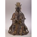 A GOOD CHINESE SEATED BRONZE FIGURE, with traces of gilt and red, the reverse with six character