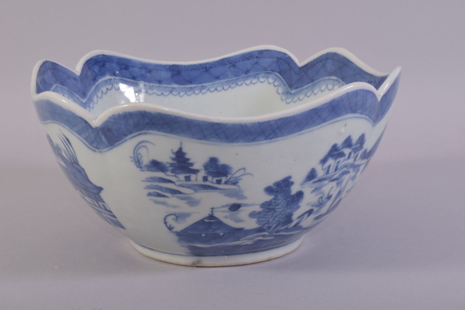 A CHINESE BLUE AND WHITE PORCELAIN BOWL, decorated with a landscape including buildings, boats and - Image 4 of 6