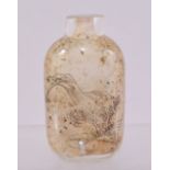 A CHINESE REVERSE PAINTED GLASS SNUFF BOTTLE, 6cm high.