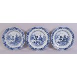 THREE CHINESE BLUE AND WHITE PORCELAIN PLATES, each painted with temples in a landscape, each