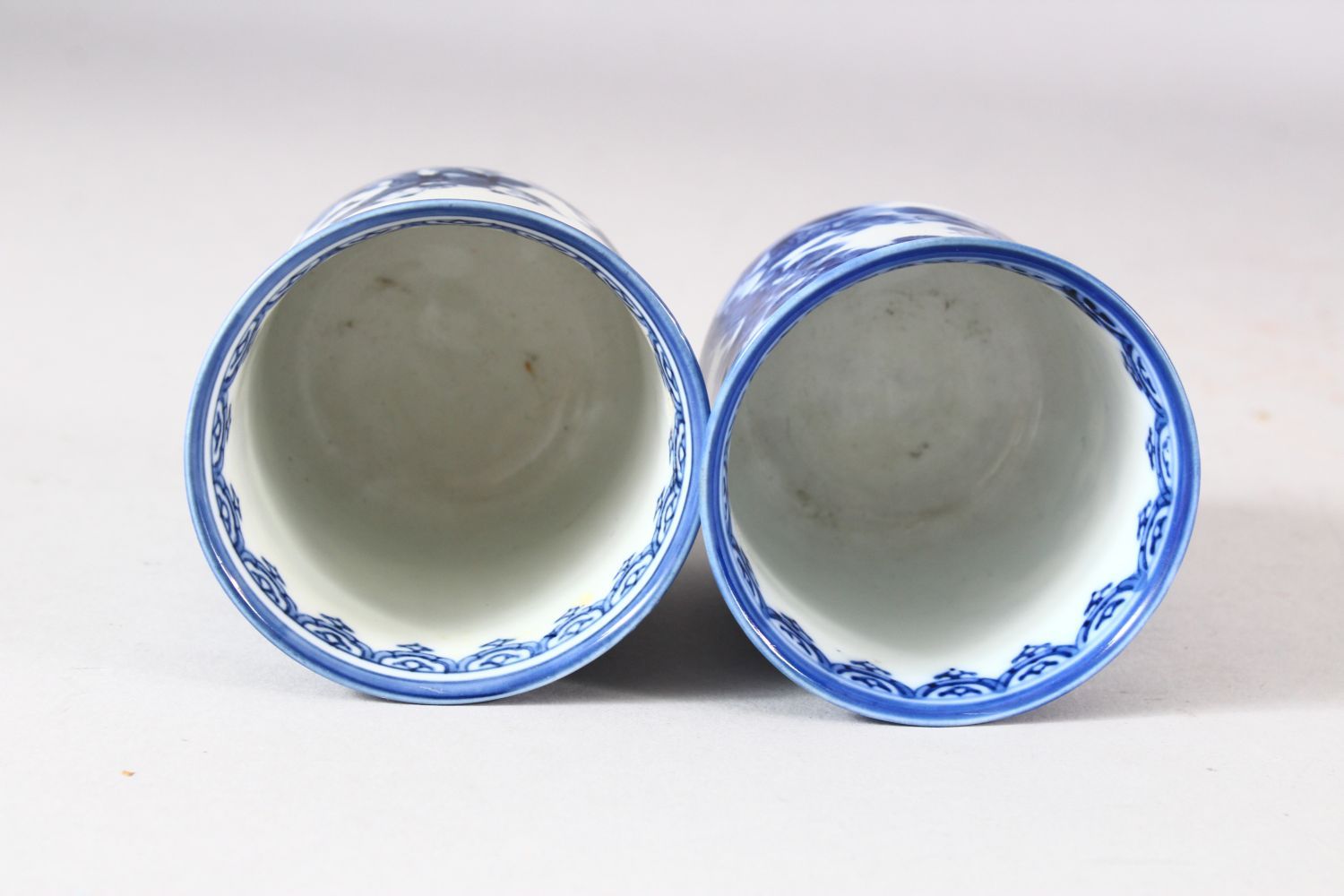 A NEAR PAIR OF JAPANESE BLUE AND WHITE PORCELAIN CUPS, decorated with boys in a landscape, 7.5cm and - Image 5 of 8