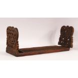 A 19TH CENTURY ISLAMIC CARVED WOOD BOOK STAND, with folding end sections carved and pierced with