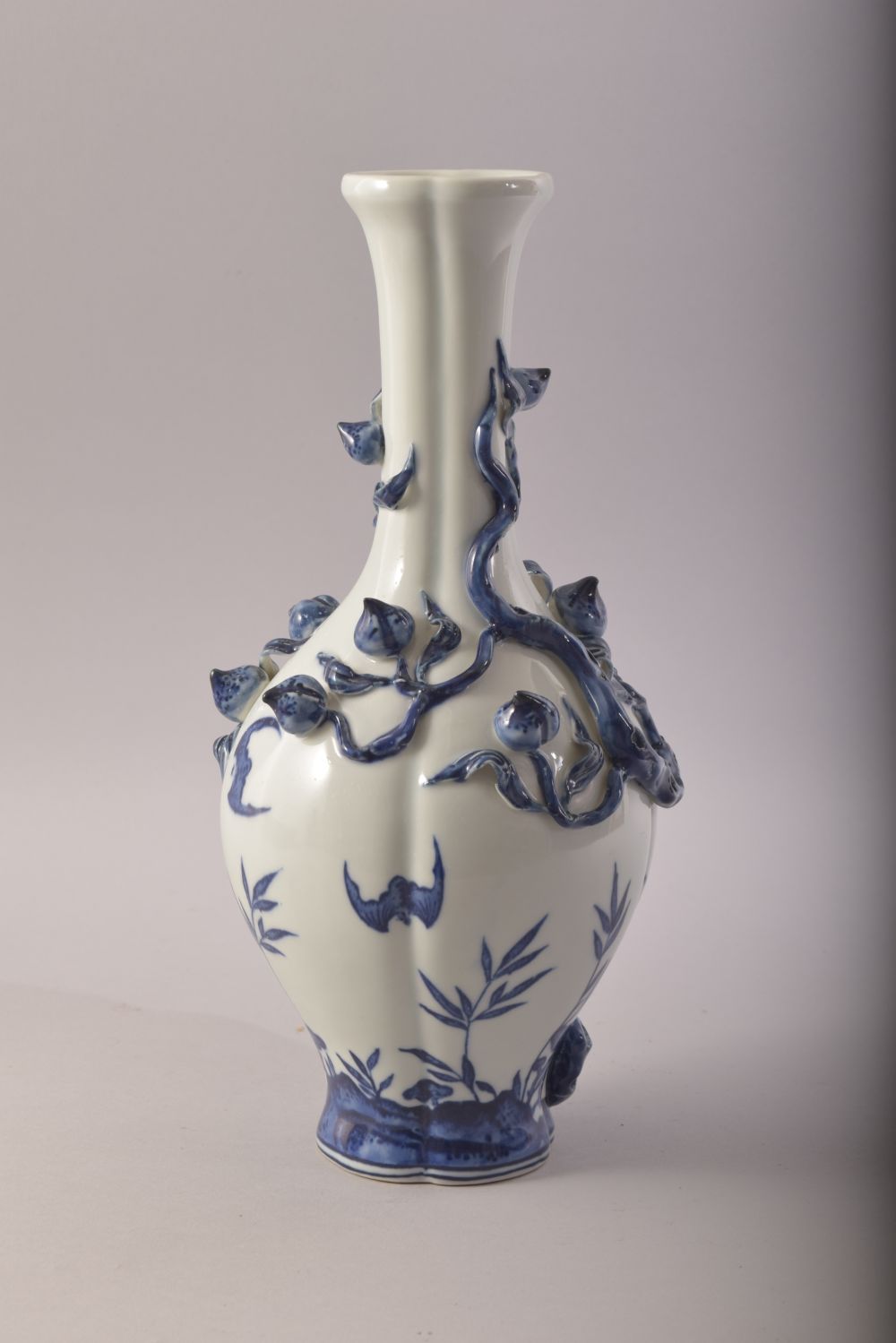 A CHINESE BLUE AND WHITE PORCELAIN VASE, with moulded relief peach tree decoration, the body with - Image 2 of 7
