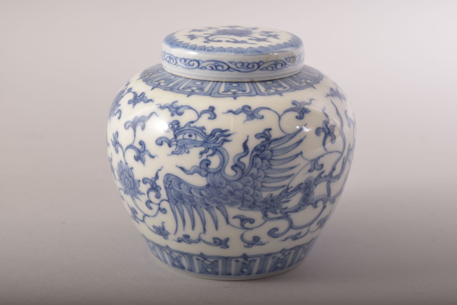 A GOOD CHINESE BLUE AND WHITE PORCELAIN JAR AND COVER, painted with phoenix, lotus and scrolling - Image 4 of 7